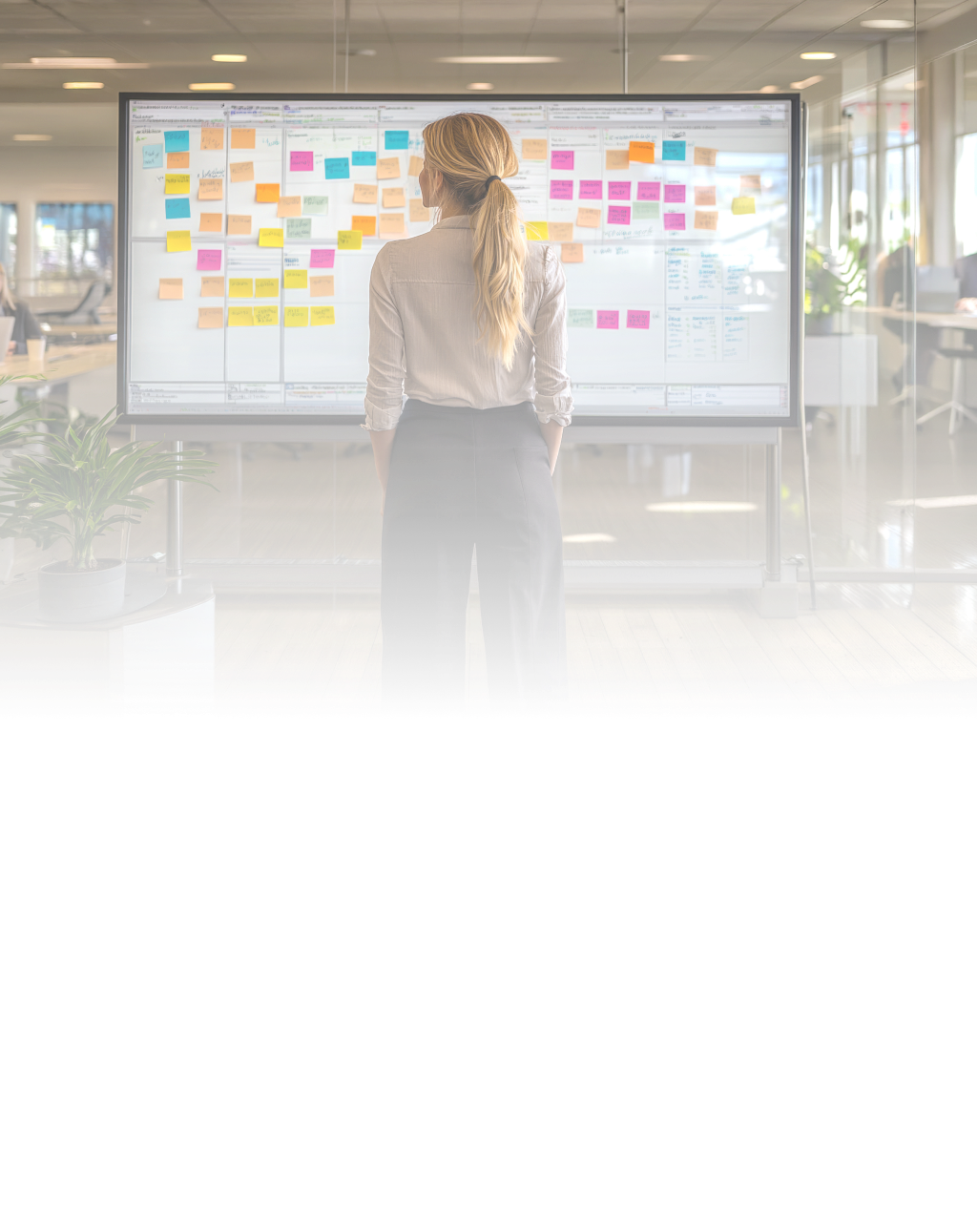 woman looking at project board