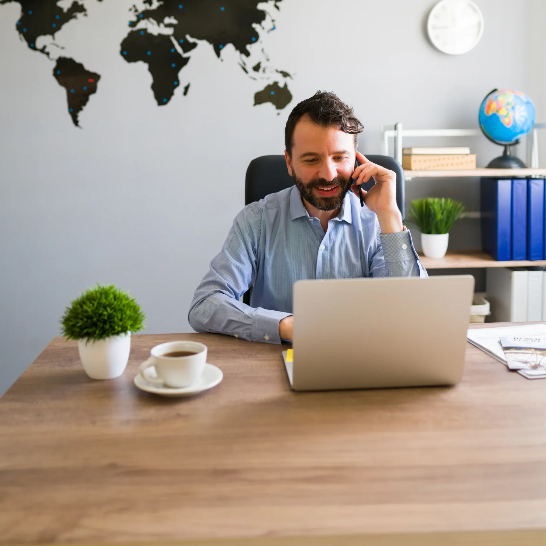 a man sitting behind computer