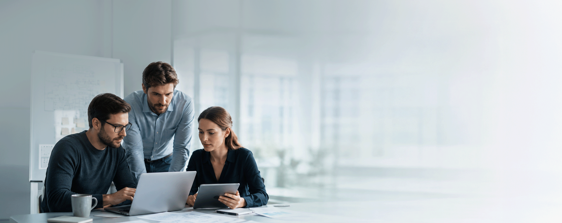 team of specialists working with multiple devices