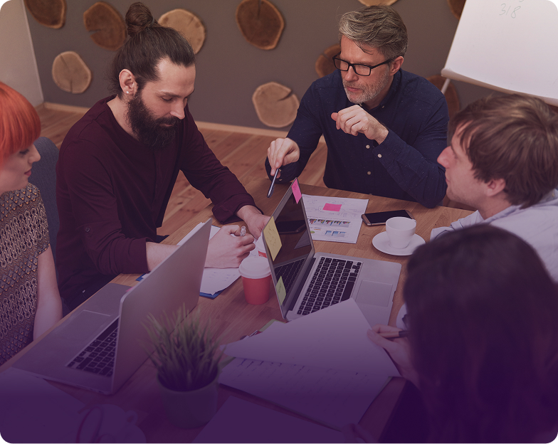 Business team collaborating around a table for industry-specific audits