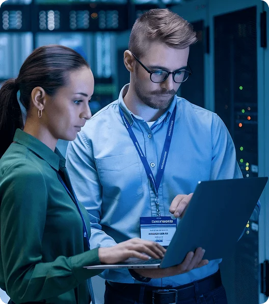 IT specialists assessing infrastructure during technical due diligence process